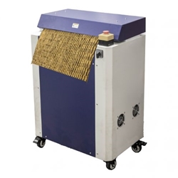 Industrial cardboard shredding machine creating eco-friendly void fill packaging.
